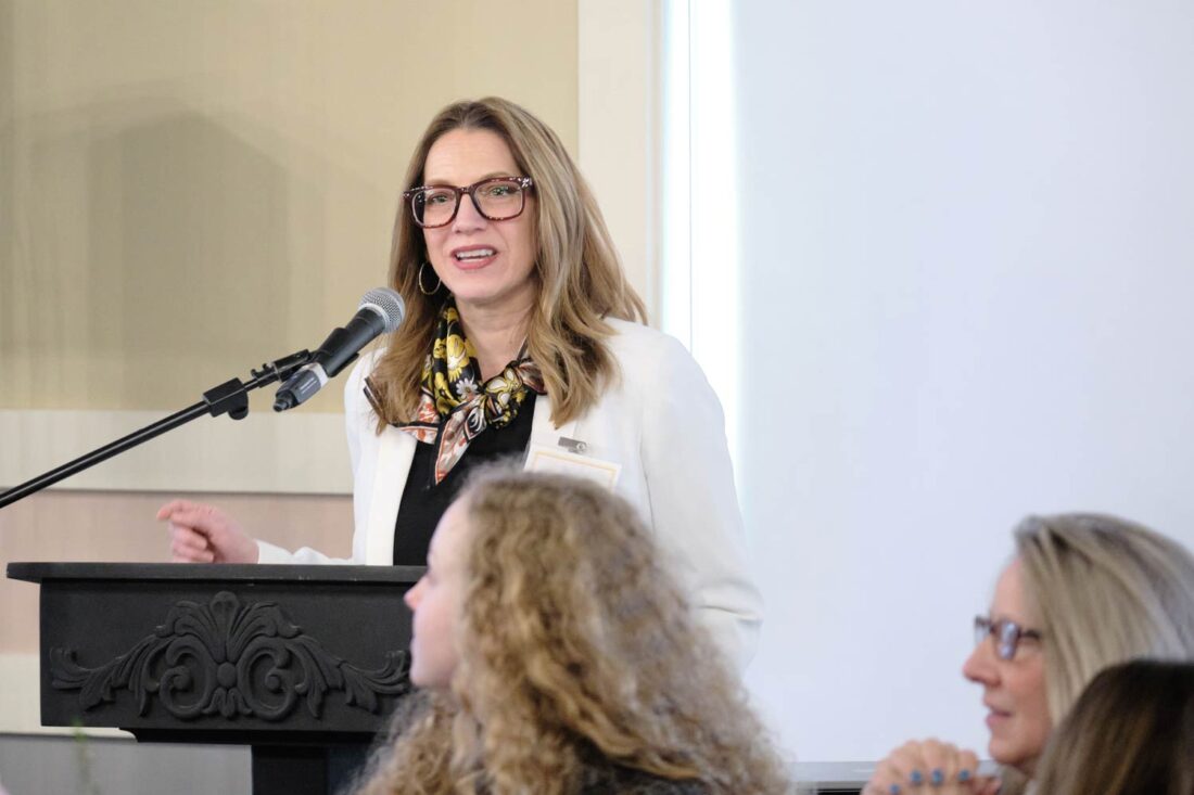 Mayor Gina Leichty speaking at the annual International Women's Day Luncheon