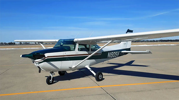 An image of a propeller airplane out on the runway of Goshen airport.