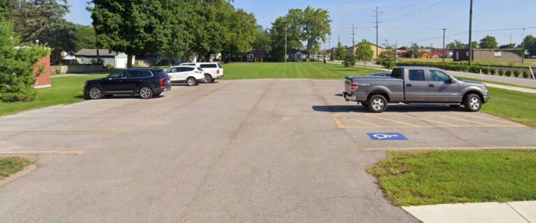 A photo of Water Tower Park's parking and open green space.
