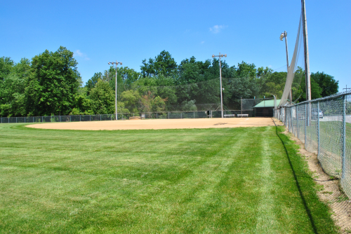 A photo of softball diamond 1's home plate and dug out.